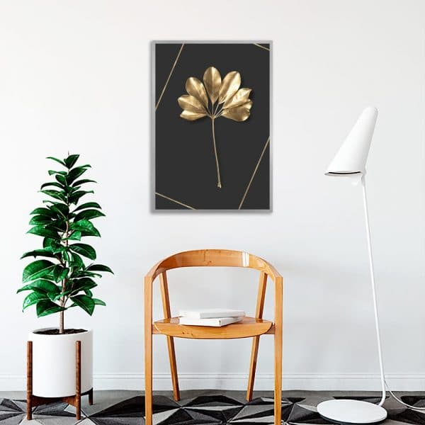 czarny plakat ze złotym liściem