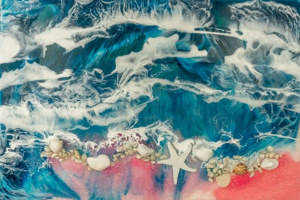 fototapeta dekoracja z kamieniami i muszelkami niebiesko różowa