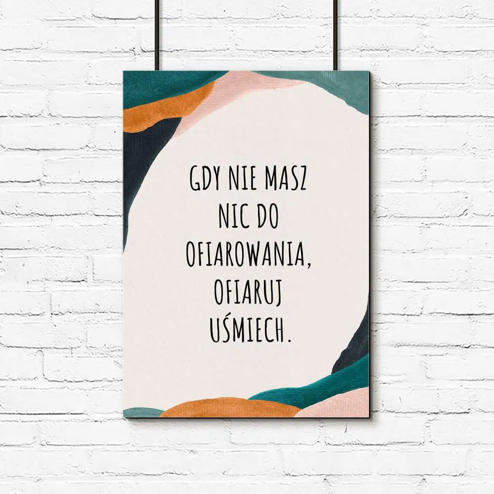 Plakat z sentencją o uśmiechu